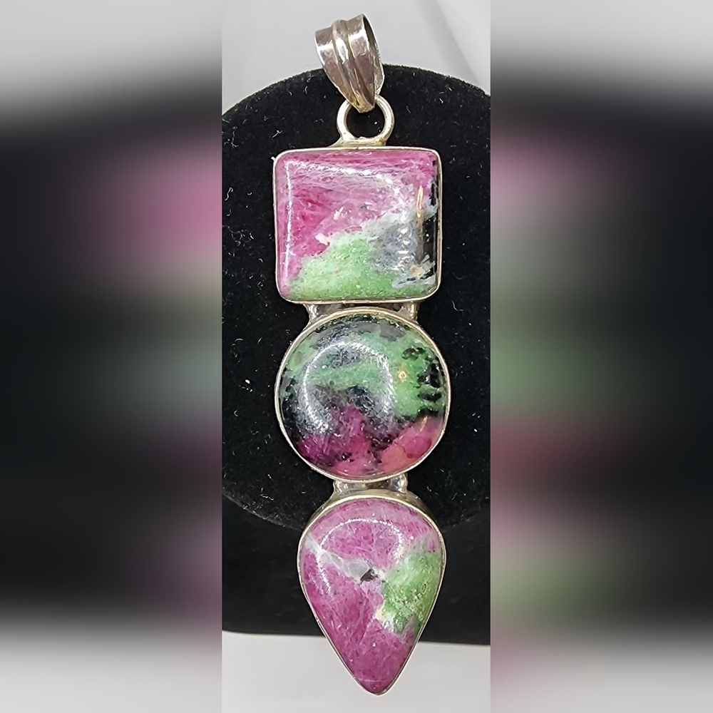 Sterling Silver ruby-zoisite Pendant with three cabochon stones.